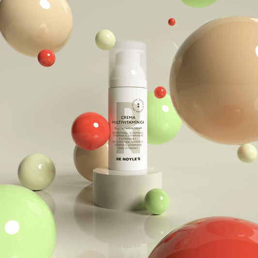 Crema Multivitamínica DE NOYLE’S con esferas coloridas que representan el complejo de vitaminas y retinol – fórmula revitalizante.